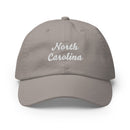 Cursive North Carolina Champion Dad Hat